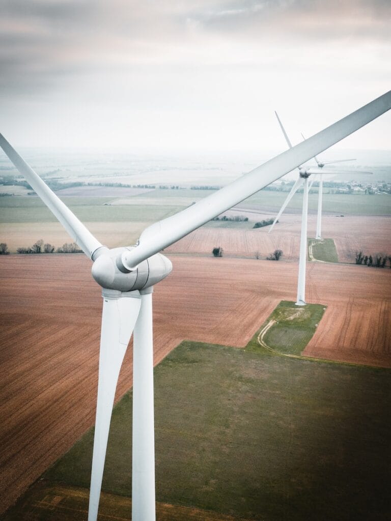 three white windmill during daytime